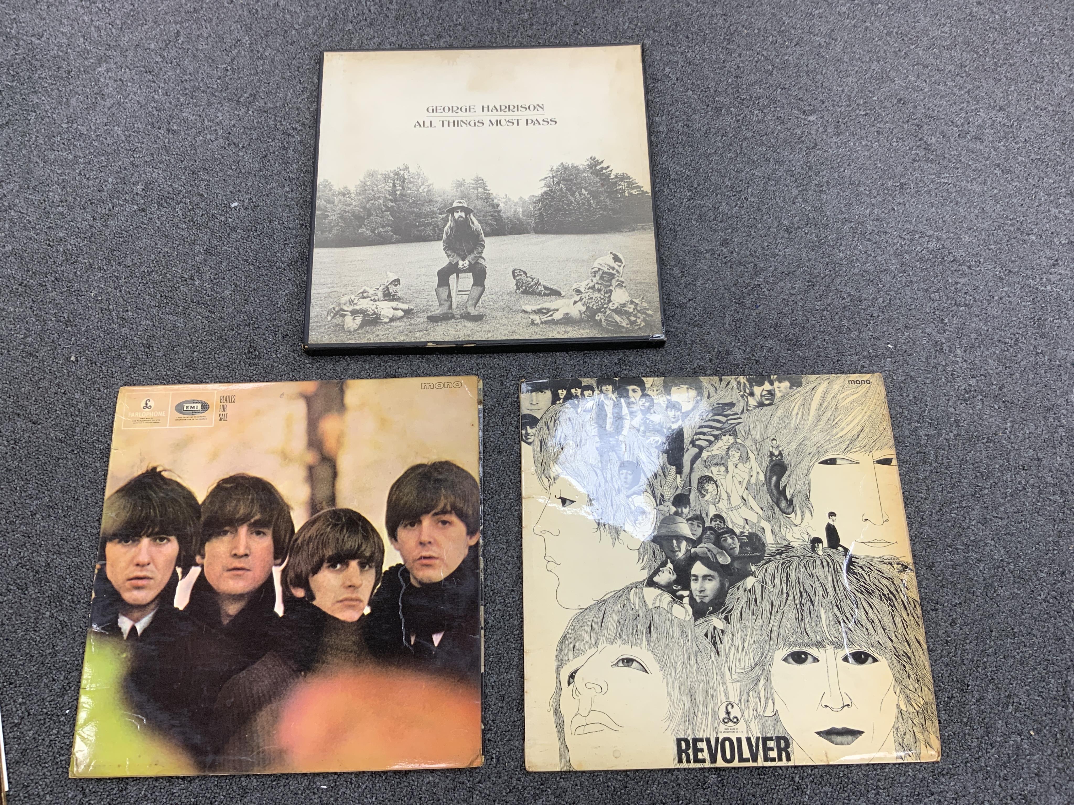 Seven The Beatles and George Harrison LP record albums; the ‘White Album’ (No.0174927), Abbey Road, PCS 7088, Sgt. Pepper, PMC 7027 (missing card insert), Revolver, PMC 7009, Beatles For Sale, PMC 1240, With The Beatles,